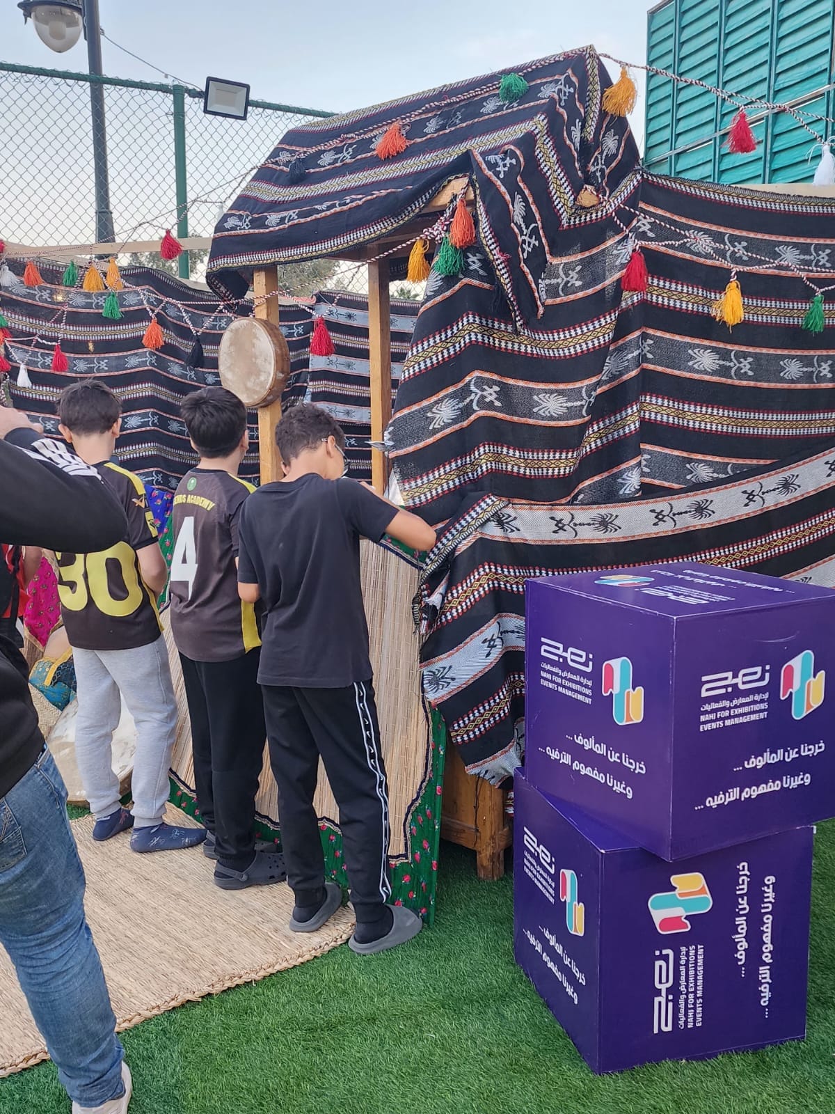 Heritage tent corner with Dana Compound branding