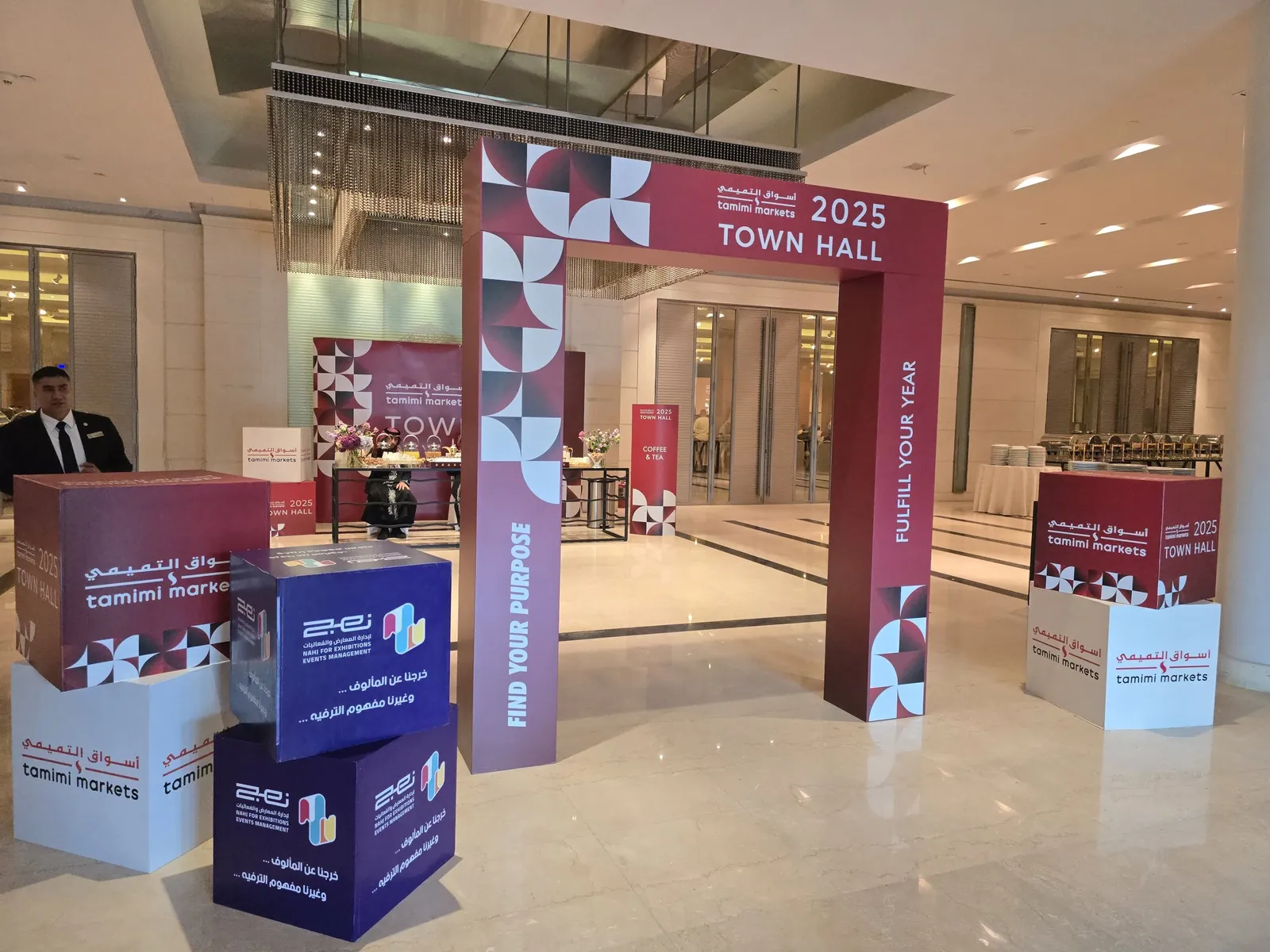 Branded 2025 Town Hall entrance arch with Tamimi and Nahj cubes in hotel foyer