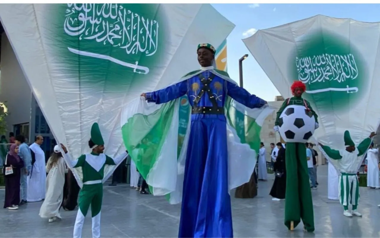 National Day stilt performers with giant flags