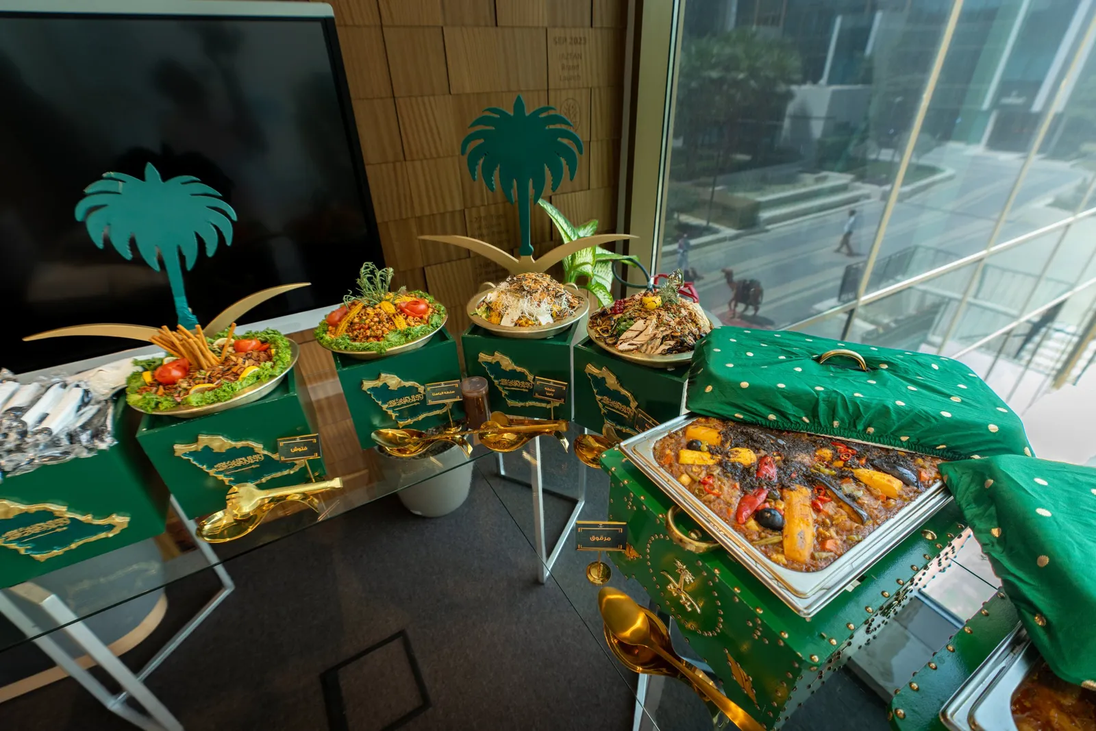 Buffet with palm-tree cutouts and gold map stands